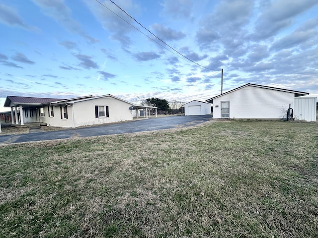 exterior space featuring an outbuilding and a garage