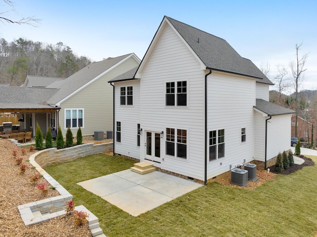 back of property featuring cooling unit, a patio area, and a lawn