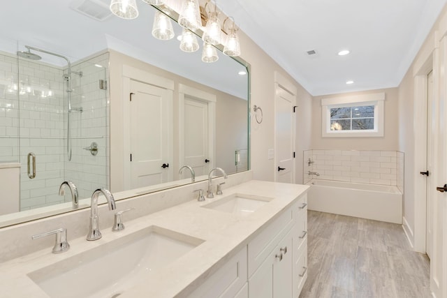 bathroom featuring vanity, hardwood / wood-style floors, and shower with separate bathtub