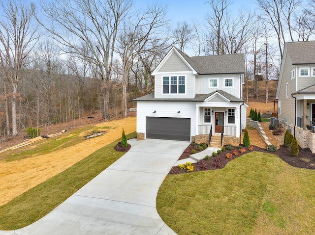 view of front of house featuring a garage and a front yard