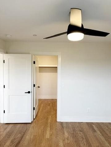 interior space with hardwood / wood-style flooring and ceiling fan