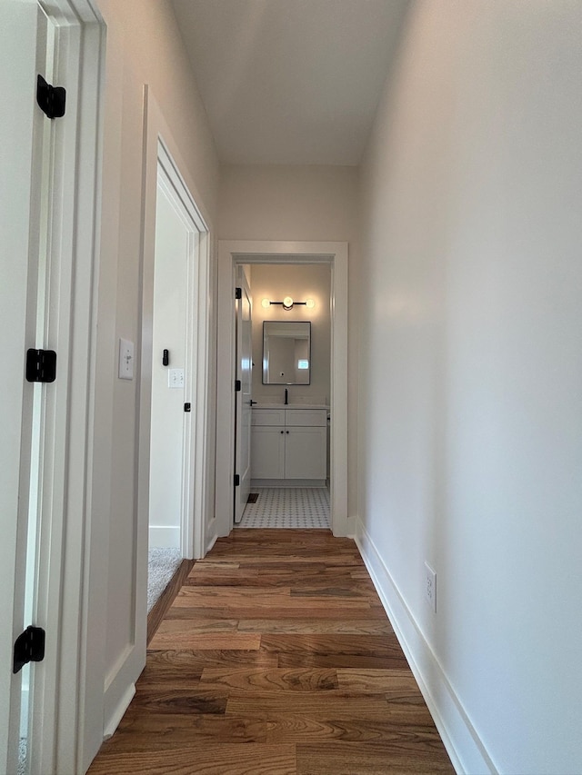 hallway with dark wood-type flooring