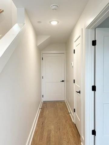 corridor with light wood-type flooring