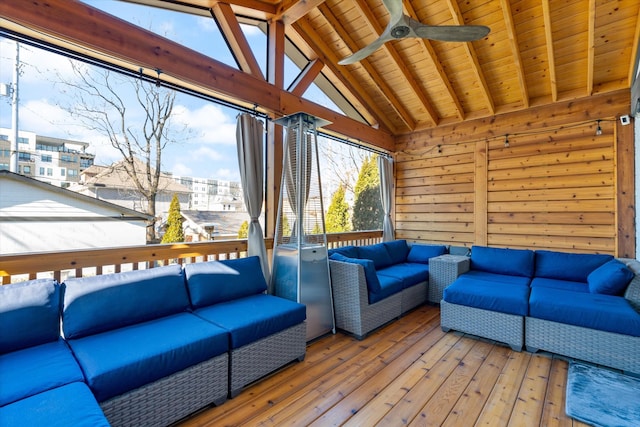 interior space with outdoor lounge area and ceiling fan