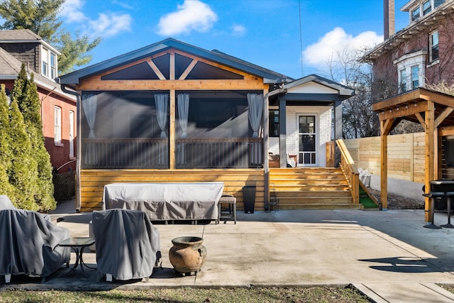 rear view of house featuring a patio area