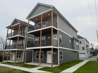 rear view of house with a lawn