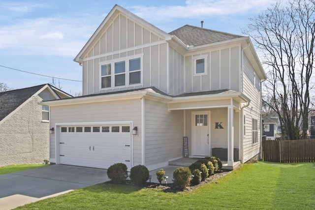 view of front of house featuring a garage and a front lawn