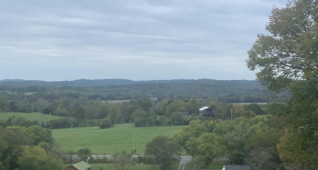 view of mountain feature with a rural view