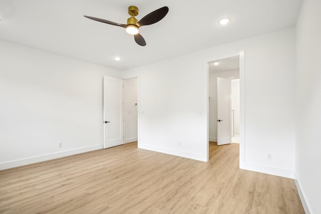 unfurnished room with ceiling fan and light hardwood / wood-style floors