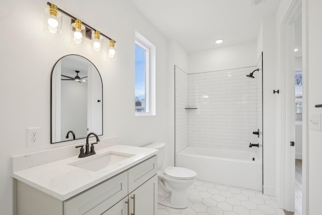 full bathroom with tiled shower / bath combo, vanity, tile patterned flooring, and toilet