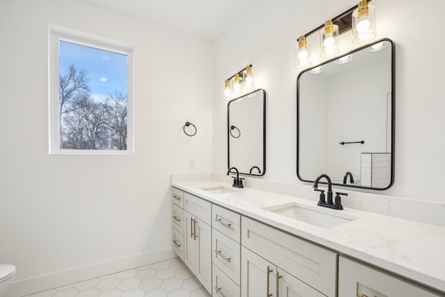 bathroom with vanity and toilet