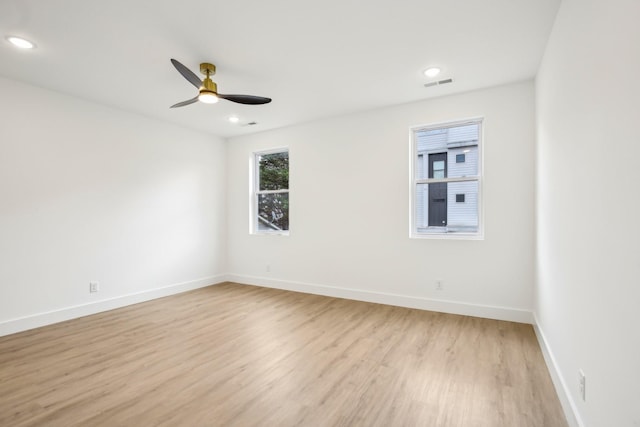 unfurnished room with ceiling fan and light hardwood / wood-style flooring