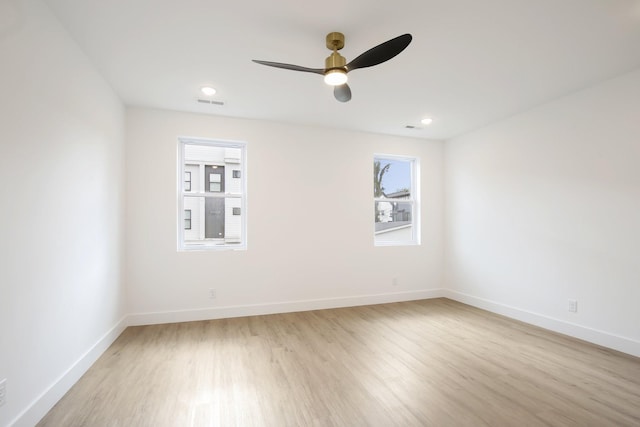 unfurnished room with light hardwood / wood-style flooring and ceiling fan