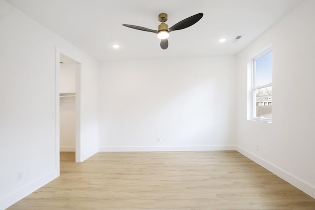 unfurnished room featuring ceiling fan and light hardwood / wood-style floors