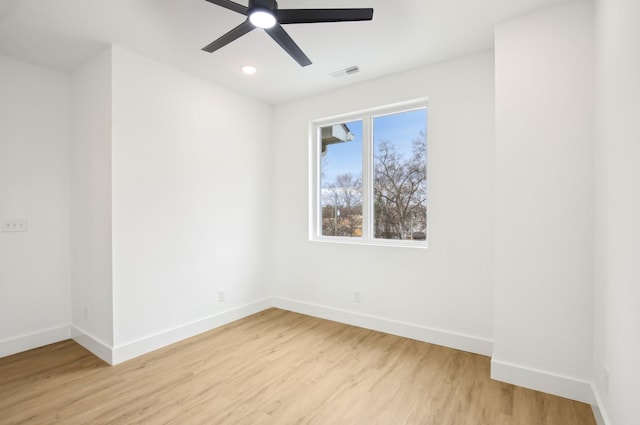 unfurnished room with ceiling fan and light wood-type flooring