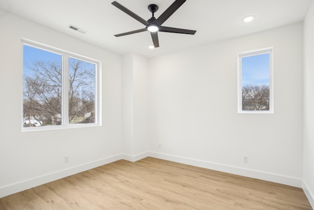 unfurnished room featuring ceiling fan and light hardwood / wood-style flooring