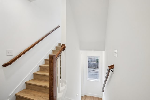 stairway featuring hardwood / wood-style flooring