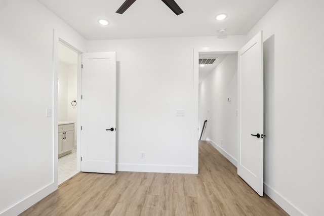 unfurnished bedroom with light hardwood / wood-style flooring and ceiling fan