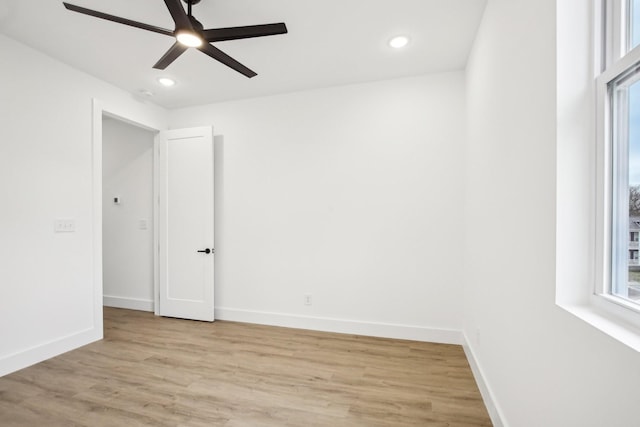 unfurnished room with ceiling fan and light hardwood / wood-style flooring