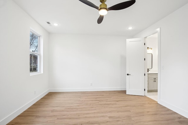 unfurnished room featuring ceiling fan and light hardwood / wood-style flooring