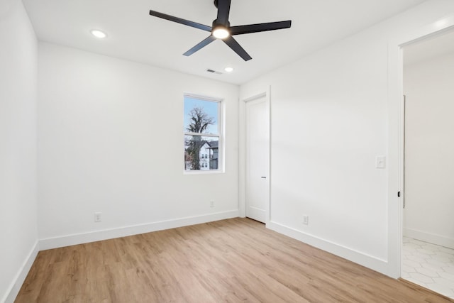 unfurnished room featuring ceiling fan and light hardwood / wood-style flooring