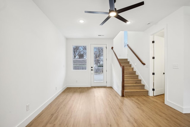 unfurnished living room with ceiling fan and light hardwood / wood-style floors