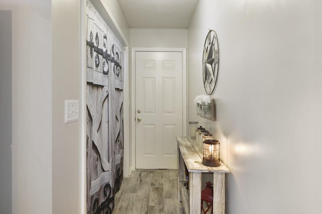 doorway to outside with light hardwood / wood-style floors