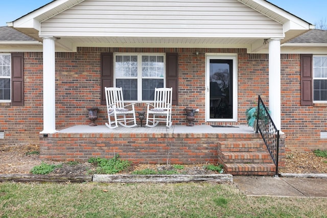 property entrance with covered porch