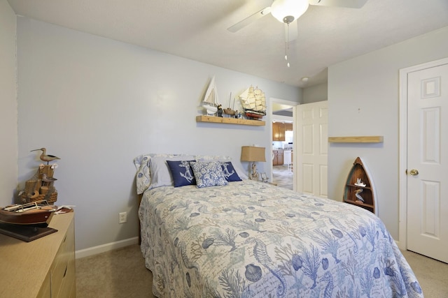 bedroom featuring light colored carpet and ceiling fan