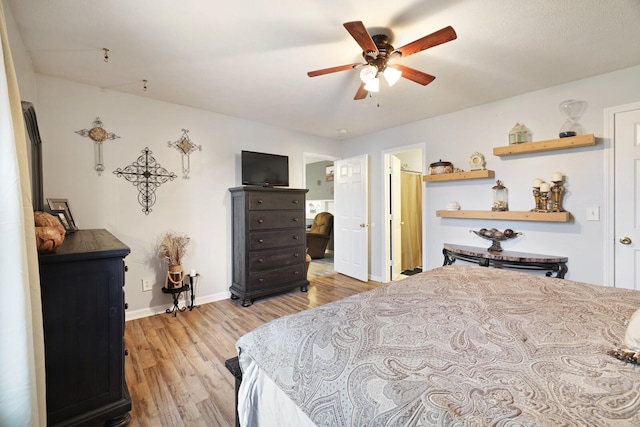 bedroom featuring ceiling fan and light wood-type flooring