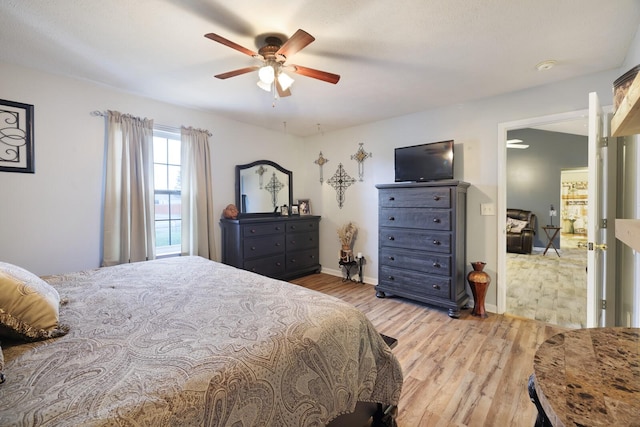 bedroom featuring light hardwood / wood-style flooring and ceiling fan