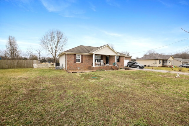 view of front of house featuring covered porch and a front lawn