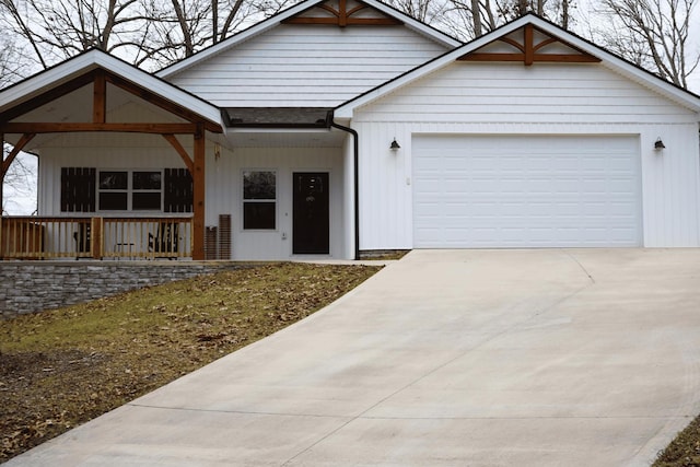 view of front of home with a garage and covered porch