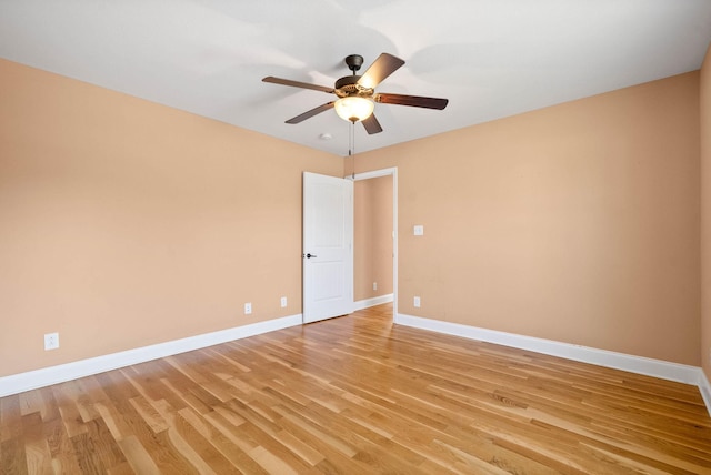 spare room featuring ceiling fan and light wood-type flooring