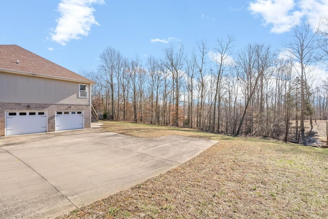 view of yard with a garage