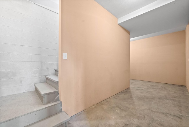 stairway with concrete floors