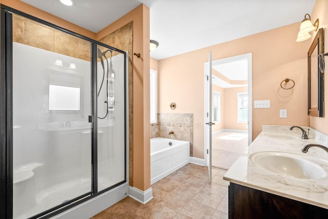 bathroom with vanity, tile patterned floors, and plus walk in shower