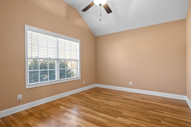 unfurnished room with vaulted ceiling, ceiling fan, and light hardwood / wood-style floors