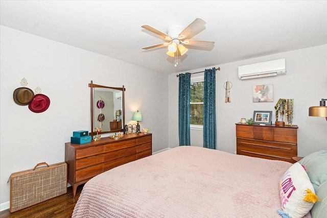 bedroom with ceiling fan, dark hardwood / wood-style flooring, and a wall mounted AC