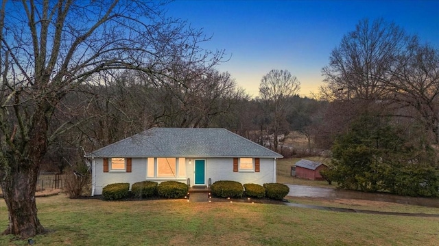 view of front of property with a yard