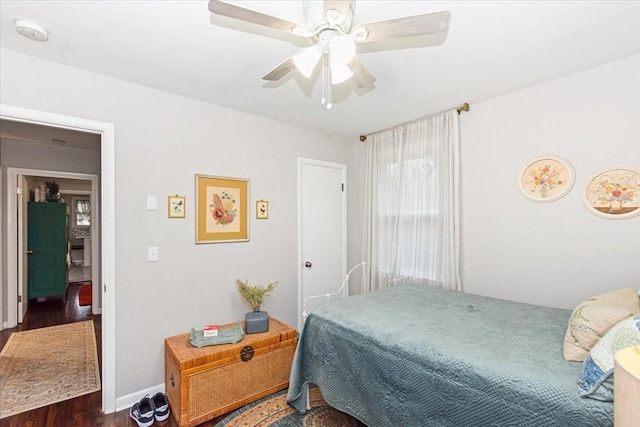 bedroom with dark wood-type flooring and ceiling fan