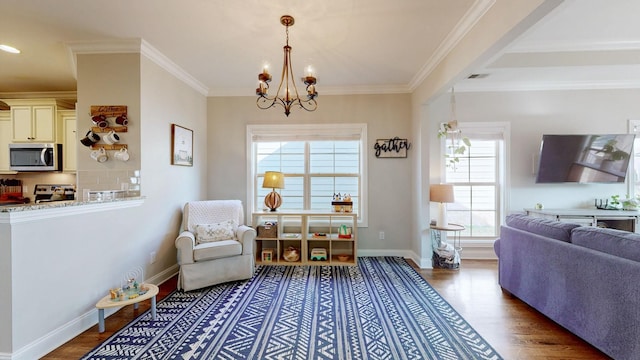 living area with ornamental molding, a chandelier, and dark hardwood / wood-style flooring