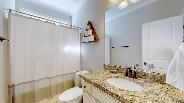 bathroom with crown molding, vanity, and toilet