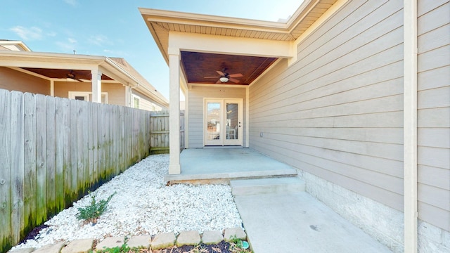 view of exterior entry featuring a patio and ceiling fan