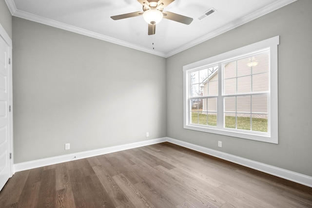 unfurnished room featuring ceiling fan, ornamental molding, and wood-type flooring