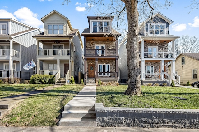 view of front of property with central AC unit and a front lawn