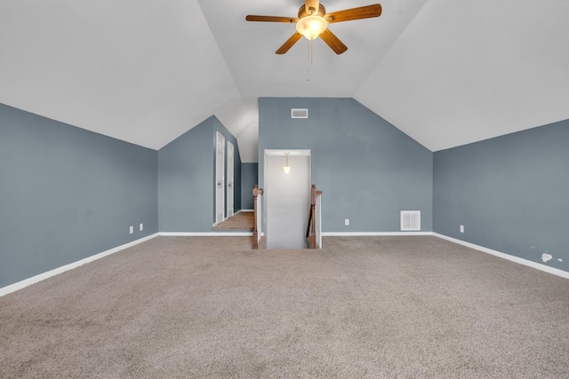 additional living space with vaulted ceiling, ceiling fan, and carpet flooring