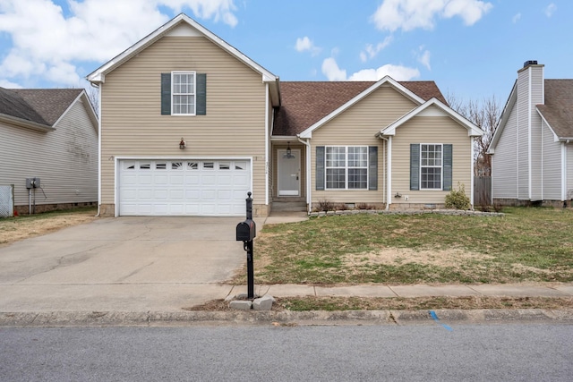 view of property featuring a garage and a front lawn