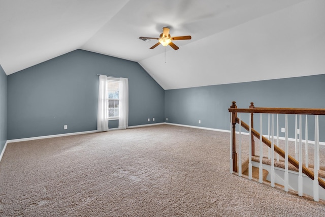 bonus room with carpet floors, lofted ceiling, and ceiling fan