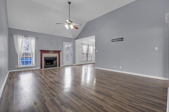 unfurnished living room featuring a fireplace, ceiling fan, dark wood-type flooring, and high vaulted ceiling